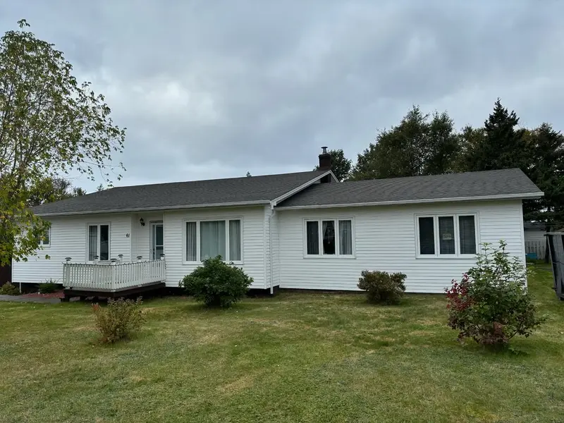 White bungalow with a new grey shingled roof