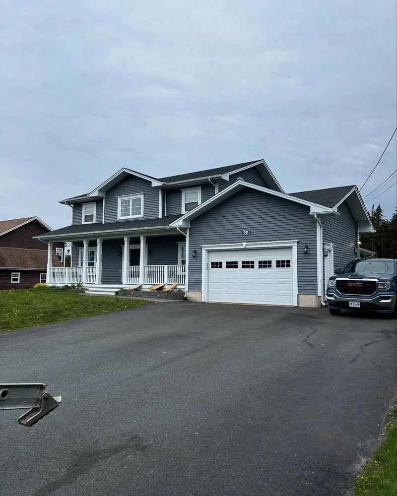 Large two-storey house with a double garage and a new roof